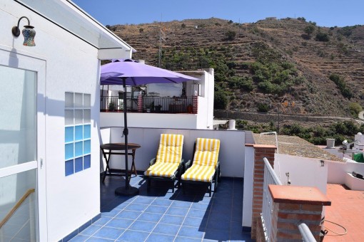 Sunny terrace with sitting area