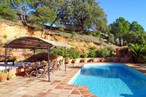 Attractive pool area with covered dining area
