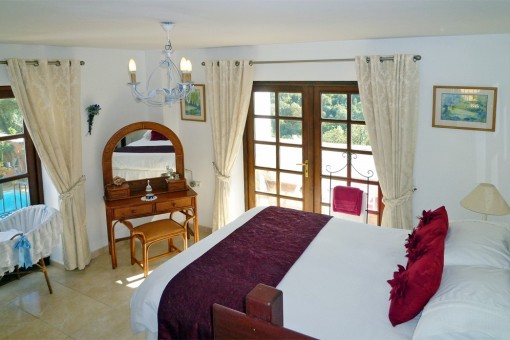 Bedroom with a view over the pool