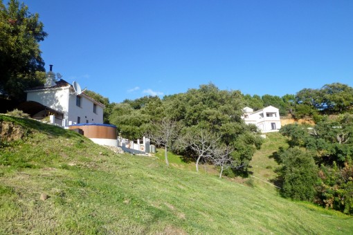 The guest house with its own pool and in the background there is the main house