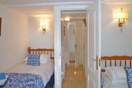 Bright bedroom with twin beds in the guest house