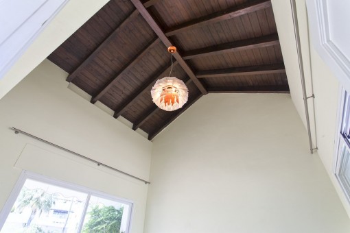 The guest bedroom offers wooden beams