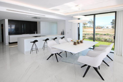 Bright dining area with open kitchen
