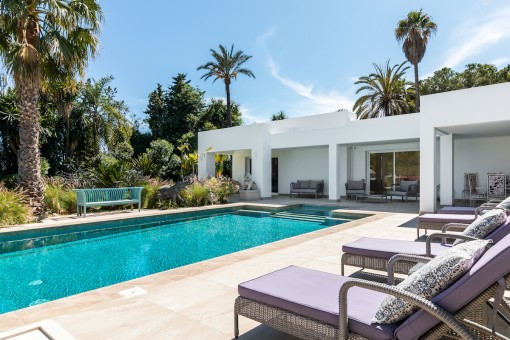 Pool area with cosy sunbeds